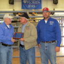 Steve Williams of J & W receiving his plaque for their consignment J&W Mr Cruising that was the winner of the FL Bull Test and SimAngus breed winner. Pictured (from L to R): Nick Comerford (NFREC Center Director), Steve Williams, and David Thomas (NFREC Beef Unit Supervisor).